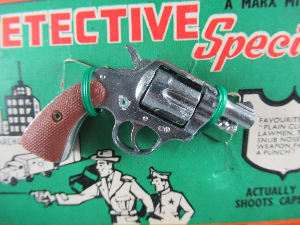 Le pistolet jouet vintage en métal du type Colt 38 special miniatures-toys