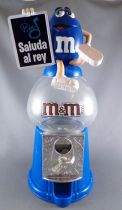 M&M\'s Candy Dispenser - Blue with Saluda al Rey Sign on Blue Counter Top Dispenser