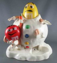 M&M\'s candy dispenser - Red and Yellow in the snow