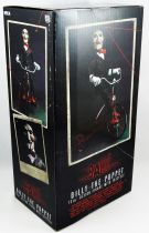 Saw - Billy la Poupée avec Tricycle 30cm (Figurine parlante) - NECA