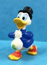 Scrooge - Disney PVC figures - Scrooge with his Dollars